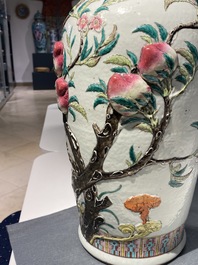 A Chinese famille rose molded 'nine peaches' vase, 19th C.
